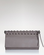 Toughen up your after-hours line up with Oryany's braided leather clutch. In a crave-worthy shape and pared-down palette, this bag loves your darkest dresses and boots.