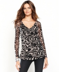 You've never seen a babydoll top like this! INC mixes sheer mesh fabric with a swingy silhouette and a bold graphic print for a completely unique look. You've never seen a babydoll top like this! INC mixes sheer mesh fabric with a swingy silhouette and a bold graphic print for a completely unique look.