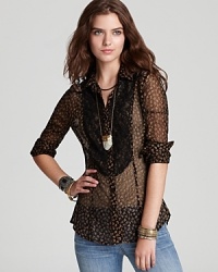 A gold metallic floral print enlivens this sheer Free People shirt with on-trend flair this fall--dress up your denim. A gold metallic floral print enlivens this sheer Free People shirt with on-trend flair this fall--dress up your denim.