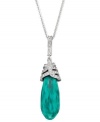 This feminine pendant features a dangling, drop-shaped emerald Swarovski crystal in an exclusive cut. Elaborate details in clear crystal pavé add a regal note to this precious design. The pendant comes on a rhodium-plated chain and is perfect for cocktail parties. Approximate length: 15-7/10 inches + 2-inch extender. Approximate drop: 1/2 inch.