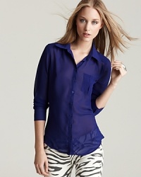 Whether worn with jeans or pencil skirts, this GUESS blouse lends sophisticated polish to every look. Whether worn with jeans or pencil skirts, this GUESS blouse lends sophisticated polish to every look.