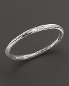 Hammered, faceted sterling silver bangle.