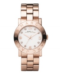 Ravishing in rose. Light up the room with the Amy watch from Marc by Marc Jacobs. Rose gold ion-plated stainless steel bracelet and round case. Bezel embossed with logo. White dial features rose-gold tone numerals at twelve, three, six and nine o'clock, crystal accents at markers, three hands and text logo. Quartz movement. Water resistant to 30 meters. Two-year limited warranty. Ravishing in rose. Light up the room with the Amy watch from Marc by Marc Jacobs. Rose gold ion-plated stainless steel bracelet and round case. Bezel embossed with logo. White dial features rose-gold tone numerals at twelve, three, six and nine o'clock, crystal accents at markers, three hands and text logo. Quartz movement. Water resistant to 30 meters. Two-year limited warranty.