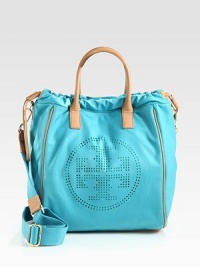 A bright and lightweight design with a perforated logo emblem accented in luxurious leather.Double leather top handles, 4 dropDetachable adjustable shoulder strap, 15-25½ dropMagnetic snap closure with drawstringOne outside open pocketOne inside zip pocketTwo inside open pocketsCotton lining11½W X 14½H X 7DImported A bright and lightweight design with a perforated logo emblem accented in luxurious leather.Double leather top handles, 4 dropDetachable adjustable shoulder strap, 15-25½ dropMagnetic snap closure with drawstringOne outside open pocketOne inside zip pocketTwo inside open pocketsCotton lining11½W X 14½H X 7DImported