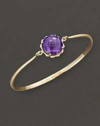 A faceted amethyst adds brilliant color to gleaming 18K yellow gold. By Carelle. A faceted amethyst adds brilliant color to gleaming 18K yellow gold. By Carelle.
