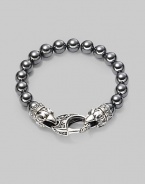 A new look for the modern man, handsomely crafted with a sterling silver raven's head clasp and a string of hematite beads. Sterling silver 10mm hematite beads Lobster clasp closure Bracelet, 9 long Imported 