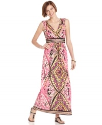 A stunning stained glass effect gives this printed maxi dress from ECI an eye-catching update. Strappy sandals ensure that the look always makes a statement.