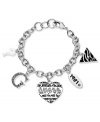 Layers of love. This GUESS bracelet features five dangling charms with a heart, triangle, G logo, question mark and date pendant with jet epoxy and sparkling crystal accents. Crafted in silver tone mixed metal. Approximate length: 7-1/2 inches. Approximate charm drop: 1-1/4 inches.
