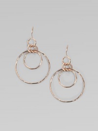 A modern mix of intertwining rings in sterling silver and 18k gold with a glowing finish of 18k rose goldplating. An alloy of 18K gold and sterling silver plated with 18K rose gold Diameter, about 2¼ Ear wire Imported A modern mix of intertwining rings in sterling silver and 18k gold with a glowing finish of 18k rose goldplating. An alloy of 18K gold and sterling silver plated with 18K rose gold Diameter, about 2¼ Ear wire Imported