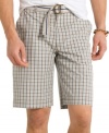 Go prepster in plaid with these comfortable flat-front seersucker shorts from Izod. (Clearance)