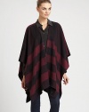 Signature check pattern is printed on sumptuous cashmere in a cape silhouette.Cashmere66 X 47Open frontDry cleanImported