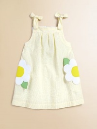 Fashioned in crisp seersucker, this cheery A-line frock is abloom in colorful stripes and tulips.SquareneckSleeveless with shoulder tiesBack zipperFlower pockets65% cotton/35% polyesterMachine washImported Fashioned in crisp seersucker, this cheery A-line frock is abloom in colorful stripes and tulips.SquareneckSleeveless with shoulder tiesBack zipperFlower pockets65% cotton/35% polyesterMachine washImported