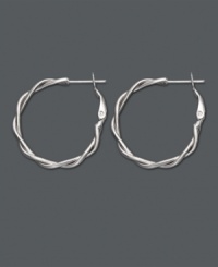 A simple twist takes your look a long way. Traditional hoop earrings feature a twisted design in sterling silver. Approximate diameter: 7/8 inch. A simple twist takes your look a long way. Traditional hoop earrings feature a twisted design in sterling silver. Approximate diameter: 7/8 inch.