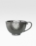 A unique mottling technique lends a hand-thumbed, hammered design to a beautiful metallic stoneware coffee cup with the look of an old-world favorite. From the Pewter Collection10-oz. capacity3H X 4½ diam.Ceramic stonewareDishwasher safeImported