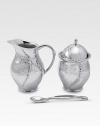 A handmade creamer and sugar set in hammered, sandcast aluminum, buffed by hand for unparalleled shine and elegance. Set includes sugar bowl with lid, creamer and matching spoon Creamer, 4½H X 3 diam. Sugar, 4½H X 3 diam. Spoon, 5 long Sandcast aluminum Food safe Hand wash Imported 