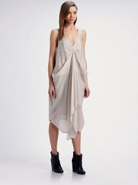 This airy, modern design features a fluttering, artfully draped overlay.V necklineSleevelessPickup drape frontSilk liningAbout 35 from natural waist75% tencel/25% nylonDry cleanMade in USA of imported fabricModel shown is 5'10 (177cm) wearing US size 4. This airy, modern design features a fluttering, artfully draped overlay.V necklineSleevelessPickup drape frontSilk liningAbout 35 from natural waist75% tencel/25% nylonDry cleanMade in USA of imported fabricModel shown is 5'10 (177cm) wearing US size 4.