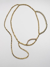 An artistic and shiny design with faceted, smooth and decorated beads in an abstract style. Glass and acrylic beadsLength, about 32Slip-on styleImported An artistic and shiny design with faceted, smooth and decorated beads in an abstract style. Glass and acrylic beadsLength, about 32Slip-on styleImported