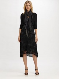 This lightweight shrug is as perfectly layered over your favorite camisole or your favorite shift.Open-front designElbow-length sleevesPull-on styleAbout 14 from shoulder to hem80% viscose/20% nylonHand washImported This lightweight shrug is as perfectly layered over your favorite camisole or your favorite shift.Open-front designElbow-length sleevesPull-on styleAbout 14 from shoulder to hem80% viscose/20% nylonHand washImported