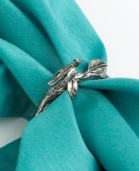 Perfect for tying together Chirp table linens, this silver-plated branch forms a whimsical napkin ring. A bird perched in its leaves makes any meal sing. Perfect for tying together Chirp table linens, this silver-plated branch forms a whimsical napkin ring. A bird perched in its leaves makes any meal sing.