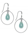 Crisp blue hues. These polished sterling silver hoops pop with the addition of blue jade drops (2-3/4 ct. t.w.). Earrings feature a fishhook backing. Approximate drop: 1 inch.