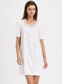 Embroidered geometric shapes adorn the neckline of this ultra-soft silhouette with feminine ruching. Sweetheart necklieShort sleevesTulle and lace embroidery at the necklineFront ruchingAbout 35 from shoulder to hemBody: mercerized cottonLace: polyesterMachine washImported Embroidered geometric shapes adorn the neckline of this ultra-soft silhouette with feminine ruching. Sweetheart necklieShort sleevesTulle and lace embroidery at the necklineFront ruchingAbout 35 from shoulder to hemBody: mercerized cottonLace: polyesterMachine washImported
