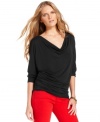 A slinky cowlneck top from MICHAEL Michael Kors embodies both versatility and romance in a softly draped silhouette. Wear it with your favorite jeans for classic style or give it an extra pop with bright colored denim.