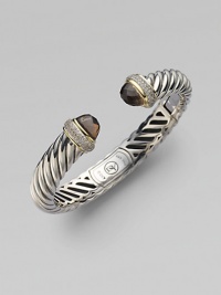 From the Waverly Collection. A sculpted cable design of sterling silver, capped with smoky quartz, and banded with 18k yellow gold and pavé diamonds.Diamonds, 0.40 tcw 18k yellow gold Sterling silver Cable, 10mm Diameter, about 2¼ Hinge clasp Imported