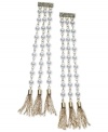 Tickle your shoulders with these tassel earrings from GUESS. With triple drops featuring glass pearls and crystals. Set in gold tone mixed metal. Approximate drop: 6 inches.