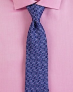 A sharply defined neat pattern is woven in premier Italian silk. About 3 wideSilkDry cleanMade in Italy