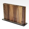 Fine teak wood is outfitted with protective acrylic covers and a magnetic panel to display up to 16 knives.