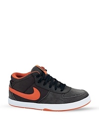 Clean and classic, this mid-top skate sneaker supports the ankle while allowing unrestricted motion and a superb board feel. Clean and classic, this mid-top skate sneaker supports the ankle while allowing unrestricted motion and a superb board feel.