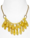 Take this season's love of bold colors to your jewel box with this beaded bib necklace from Aqua, accented by a cluster of yellow-colored drop beads and a textured chain.