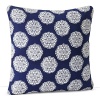 Floral medallions in white and indigo on a field of bold blue are hand printed on this decorative pillow.