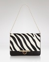 This perennially polished DKNY clutch gets wild in spot-splashed calf hair with luxe leather trim. Let this beauty be the basis of your next fashion moment.