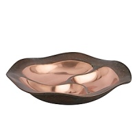 The Copper Canyon Collection was inspired by the designer's many trips to the canyons of the southwest. Grand Canyon, Arches National Park, Bryce Canyon and others. These canyons are carved from water and wind. The coppery sand and desert flora are referenced by the copper and verdigris on the ripples and ridges of Nambé's Copper Canyon Collection. The Copper Canyon Collection was inspired by the designer's many trips to the canyons of the southwest. Grand Canyon, Arches National Park, Bryce Canyon and others. These canyons are carved from water and wind. The coppery sand and desert flora are referenced by the copper and verdigris on the ripples and ridges of Nambé's Copper Canyon Collection.