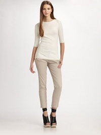 Fitted ribbed crewneck in pure silk with three-quarter sleeves and a length that hits below the hips. CrewneckThree-quarter sleevesLonger length hits below the hips40% rayon/30% nylon/25% polyester/5% cashmereDry cleanImportedModel shown is 5'11 (180cm) wearing US size Small. Fitted ribbed crewneck in pure silk with three-quarter sleeves and a length that hits below the hips. CrewneckThree-quarter sleevesLonger length hits below the hips40% rayon/30% nylon/25% polyester/5% cashmereDry cleanImportedModel shown is 5'11 (180cm) wearing US size Small.