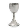An elegant addition to holidays and Friday night dinners, this Kiddush cup possesses timeless beauty. In the designer's own words, the Molten collection is distinguished by streamlined, timeless shapes... objects which reverberate with the skill of their maker and yet do not fit into a traditional interpretation of craft. The pieces possess a soulfulness and organic energy only possible through the handmade process.