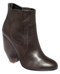Take a look at that heel. RACHEL Rachel Roy's Quendal boots have an unique chunky wooden heel that adds depth to this polished boot. Elastic gore on the sides provides a roomy, customized fit. Take a look at that heel. RACHEL Rachel Roy's Quendal boots have an unique chunky wooden heel that adds depth to this polished boot. Elastic gore on the sides provides a roomy, customized fit.