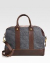 A handsome design for the globe-trotting gentleman, this well-crafted duffel is an ideal choice for heavy-duty day trips to weekend getaways, crafted in a rich cotton with gold hardware and a smooth leather trim for a refined finish.Zip closureDouble top handlesDetachable shoulder strapCotton17W x 13H x 8DImported