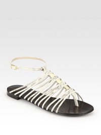 Goldtone hardware and skinny snake-print leather hold the foot in place with an adjustable ankle strap. Snake-print leather upperLeather lining and soleMade in ItalyOUR FIT MODEL RECOMMENDS ordering one half size up as this style runs small. Goldtone hardware and skinny snake-print leather hold the foot in place with an adjustable ankle strap. Snake-print leather upperLeather lining and soleMade in ItalyOUR FIT MODEL RECOMMENDS ordering one half size up as this style runs small.