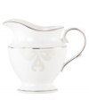 Refine your formal table with classic cream and white Lenox dinnerware. Dishes, including this Opal Innocence Scroll bone china creamer, are trimmed in platinum and accented with a raised dot and scroll pattern, bringing contemporary grace to special occasions. A pearlized finish adds subtle shimmer.