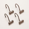 Bronzed and beautiful, these metal hooks complement classic bathroom decor.