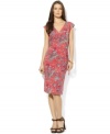 A bold, bright paisley print enlivens this petite feminine dress from Lauren by Ralph Lauren in breezy stretch jersey, tailored in a flattering faux-wrap silhouette for a chic, modern look.