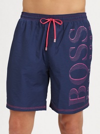Hit the beach in authentic style in a solid pair with contrast stitching and largelogo detail.Elastic drawstring waistSide slash, back flap pocketInseam, about 7PolyamideMachine washImported