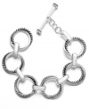 Uniquely updated. A classic chain link bracelet is a must-have for any jewelry collection, but this Lauren Ralph Lauren version takes a chic, contemporary approach with its distinctive twist design. Set in silver tone mixed metal, it features a toggle closure. Approximate length: 8 inches.