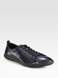 Polished, calfskin leather lace-up design with cap-toe detail and logo-embossed rubber sole for added comfort and support.Ankle pull tabLeather upperLeather liningRubber soleImported Polished, calfskin leather lace-up design with cap-toe detail and logo-embossed rubber sole for added comfort and support.Ankle pull tabLeather upperLeather liningRubber soleImported
