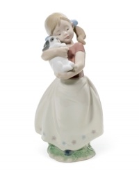 A baby herself, this pig-tailed cutie smothers her new puppy with love. Wearing blue bows in her hair and a floral-patterned skirt, this Lladro figurine warms the heart of any collector. A baby herself, this pig-tailed cutie smothers her new puppy with love. Wearing blue bows in her hair and a floral-patterned skirt, this Lladro figurine warms the heart of any collector.
