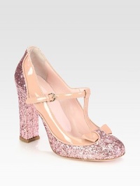 For extra va-va-voom, try this glittery patent leather pump with a feminine t-strap and bow. Glitter-covered heel, 4 (100mm)Glitter-coated fabric and patent leather upperAdjustable t-strapLeather lining and solePadded insoleMade in ItalyOUR FIT MODEL RECOMMENDS ordering true size. 