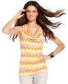 A classic cowlneck top from INC hides a surprise: a sexy cutout in the back! Zigzag-burnout printed fabric gives it pop!