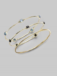 Five faceted black onyx stones are sprinkled along a slender bangle of 18k gold. Black onyx 18k yellow gold Diameter, about 2¾ Imported Please note: Bracelets sold separately.